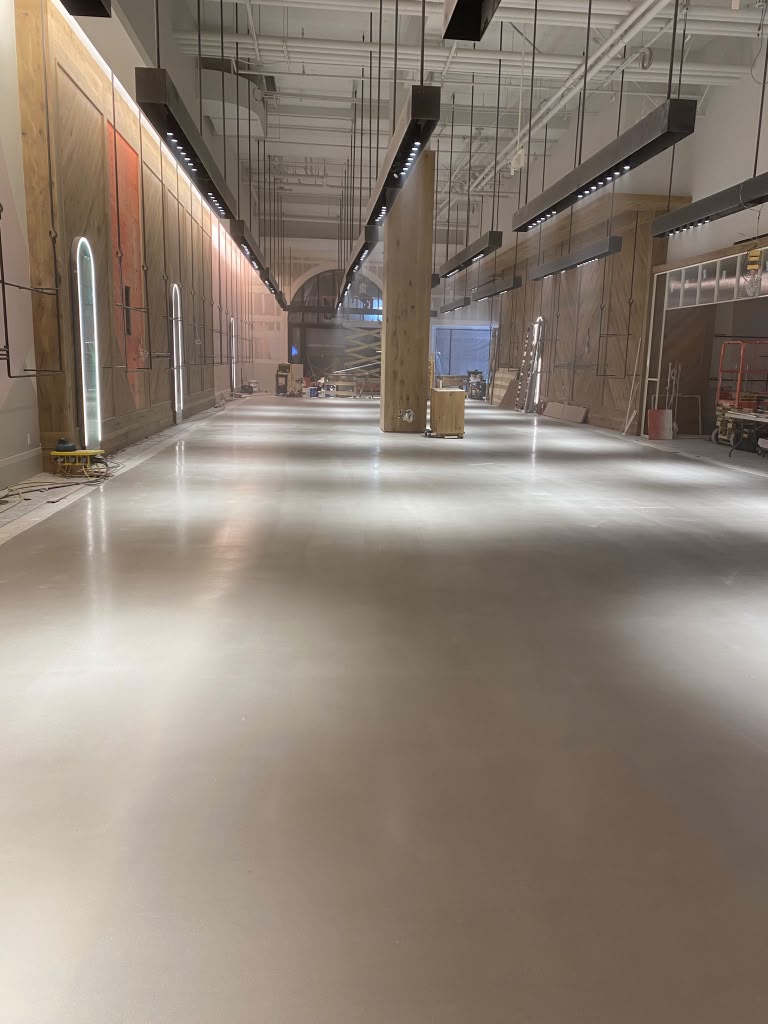 Retail polished concrete with multiple epoxy coloring tints